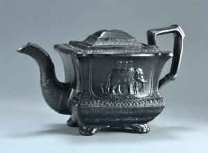 Black basalt teapot with elephants. Marked CYPLES, this is the larger version, only two marked examples known. 148mm High. c.1825-1835. AP/551.