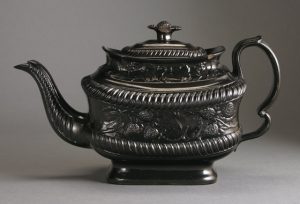 Black basalt teapot with strawberry plant design, Possibly Leeds. 135mm High. c.1820-1835. AP/554.