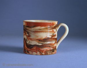 Creamware marbled-ware coffee can, slip decoration related to mochaware. 56mm High. c.1800-1820. AP/813.