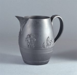 Black basalt barrel shape jug, sprigs & engine turning, possibly by Birch. 124mm High. c.1795-1810. AP/878.