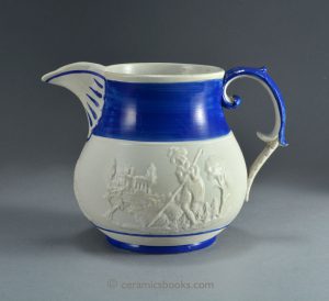 Felspathic stoneware jug with 'highlander' sprigs, poss. Scottish. c.1800-1825. AP/716.