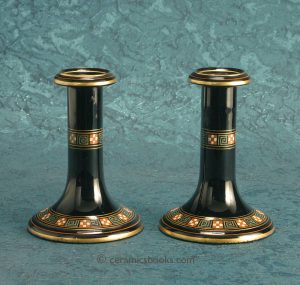 Pair of Jackfield type candlesticks with enamel and gold decoration. c.1870-1890. AP/895+896.