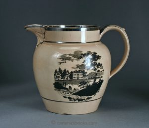 Silver lustre jug with bat prints. Drab tan body. 143mm High. c.1810-1820. AP/162.
