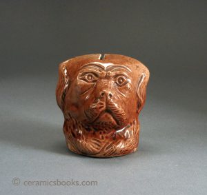 Earthenware dog's head moneybox. Bohemia / Austria ("Four Colour Pottery" FCP). Rated C. 75mm High. c.1890-1900. AP/202.