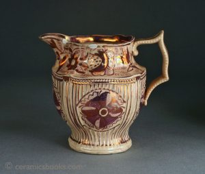 Pink/copper lustre moulded jug, tan body, fluted. 108mm High. c.1810-1825. AP/229.