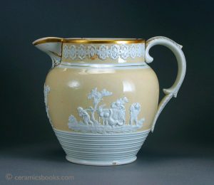 Large pearlware jug with cream slip ground and sprigs incl. 'Boys with Goat' etc. 183mm High. c.1815-1835. AP/562.