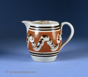 Small industrial slipware jug with cabling or worm decoration (related to mochaware). 84mm High. c.1825-1845. AP/732.