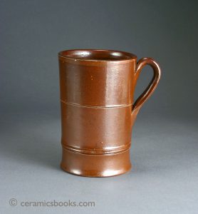 English brown salt-glazed stoneware 'mulling' tankard. 133mm High. c.1750-1800. AP/066.