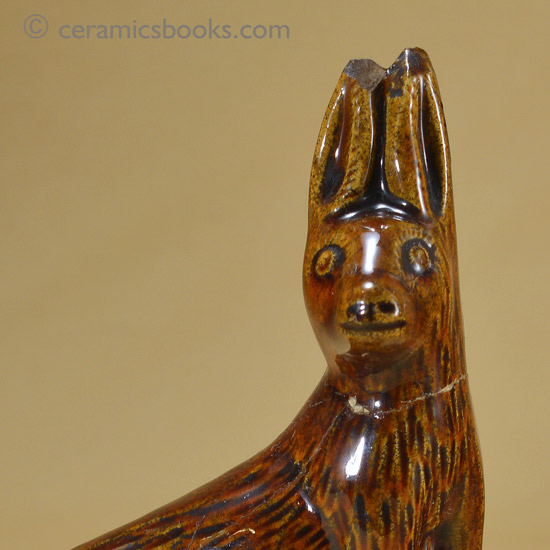 Small treacleware figure of a hare or rabbit.. Head. AP/1028.