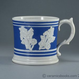 Pearlware banded ware frog mug with white flower sprigs c.1845 - 1870. Obverse. AP/1041.