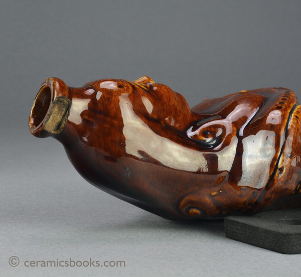 Treacleware (Rockingham glazed) figural spirit flask in the form of a mermaid c.1840-1870. Neck. AP/1121.