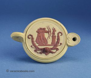 Caneware ‘Roman’ oil lamp with rosso antico sprig “Archers at the Statue of Diana”, Wedgwood. 125mm Long. c.1785-1805. AP/1236.