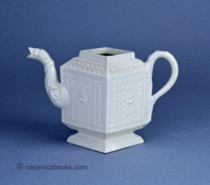 Staffordshire white salt-glaze stoneware lozenge teapot with shells and Greek key. 109mm High. c.1740-1750. AP/1243.