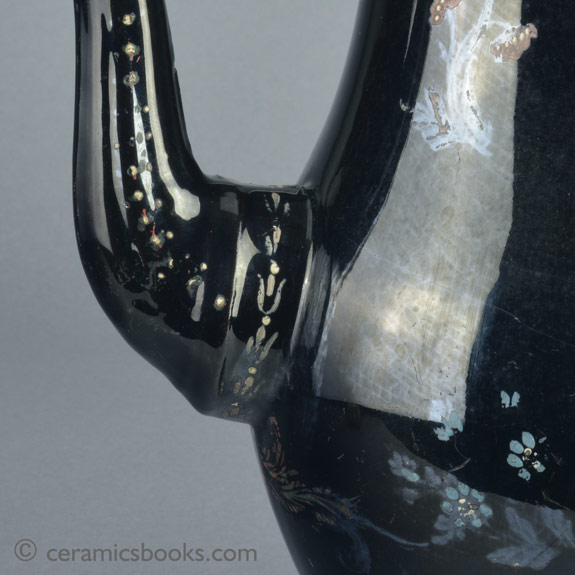 A very large Shining Black 'Jackfield' type coffeepot with cold enamelled flowers c.1770-1780. Spout. AP/1254.