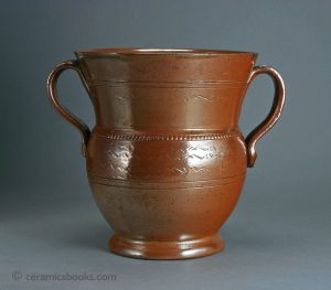 Nottingham or Derbyshire brown salt-glazed stoneware loving cup. 182mm High. c.1790-1825. AP/278.