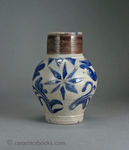 Westerwald salt-glazed stoneware jug with incised flowers and star. 159mm High. c.1730-1760. AP/417.
