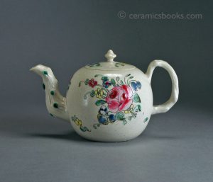 White salt-glazed stoneware teapot with enamelled flowers. 84mm High. c.1750-1760. AP/435.