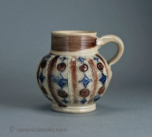 Westerwald grey salt-glazed stoneware jug with sprig strips. 101mm High. c.1695-1730. AP/537.