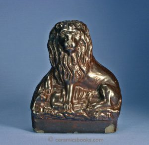 'Sewer-pipe' ware, brown salt-glazed stoneware figure of the English Lion's Victory over Napoleon. 216mm High. c.1820-1860(?). AP/567.