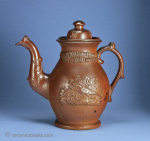 Brown salt-glazed stoneware coffee pot with hare and pheasant sprigs. Possibly Brampton, Derbyshire. 218mm High. c.1830-1845. AP/568.