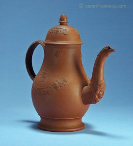 Red stoneware coffee pot with female face on spout. Possibly Leeds Pottery. 212mm High. c.1765-1775. AP/663.