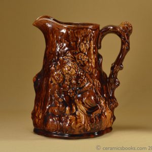 Large moulded jug ‘Babes in the Wood’ with two-tone treacleware glaze. Obverse. AP/695.