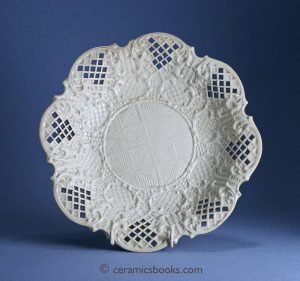 White salt-glazed stoneware dish with rococo scrolls, diaper & dot and basket weave moulding. Pierced trellis border. 233mm Wide. c. 1760-1780. AP/721.