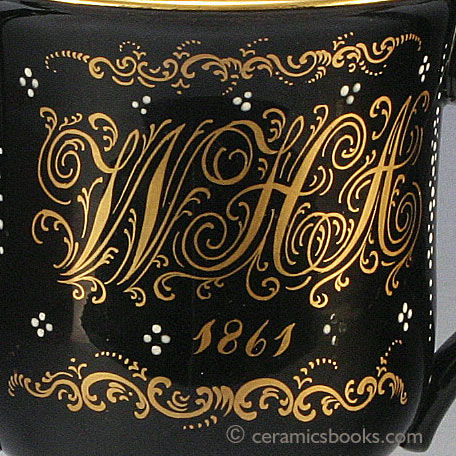 Jackfield glazed two-handled loving cup with ‘W H A’ monogram, dated 1861. Inscription. AP/779