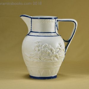 Felspathic stoneware slip-cast jug with hunting scene, blue enamel edging. Obverse. AP/782.