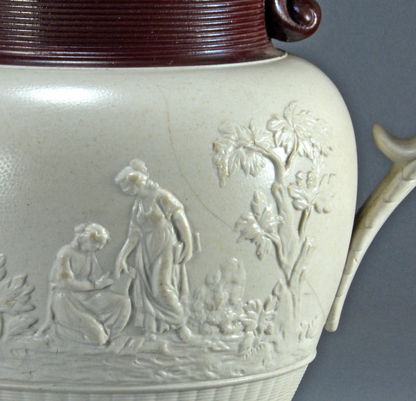 Large white felspathic stoneware jug with ‘Three Graces’ sprigs etc. Probably Davenport c.1805-1830. Damage obverse. AP/792.