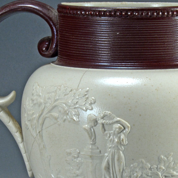 Large white felspathic stoneware jug with ‘Three Graces’ sprigs etc. Probably Davenport c.1805-1830. Damage reverse. AP/792.