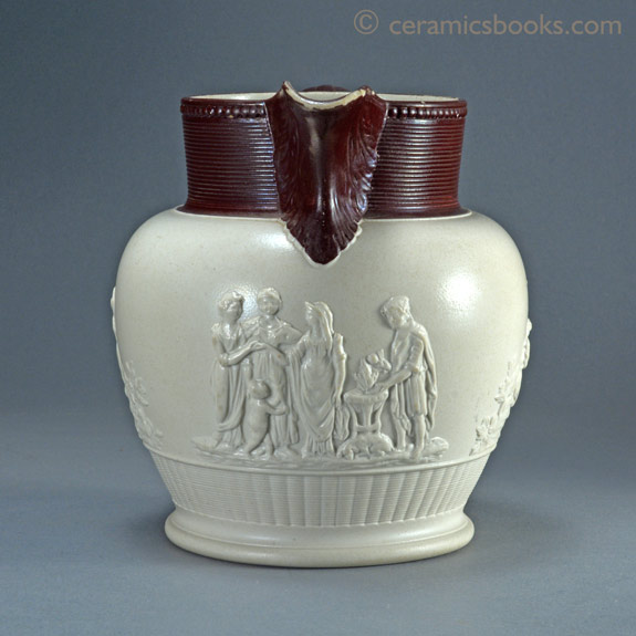 Large white felspathic stoneware jug with ‘Three Graces’ sprigs etc. Probably Davenport c.1805-1830. Front. AP/792.