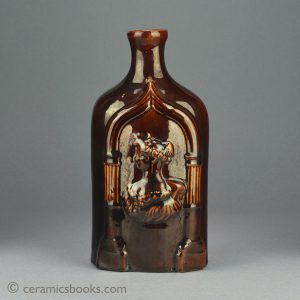 Treacleware (Rockingham glazed) spirit flask with Queen Victoria & the Duchess of Kent. c.1838-1861. Front. AP/839