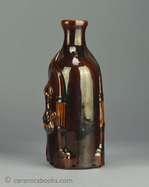 Treacleware (Rockingham glazed) spirit flask with Queen Victoria & the Duchess of Kent. c.1838-1861. Side one. AP/839