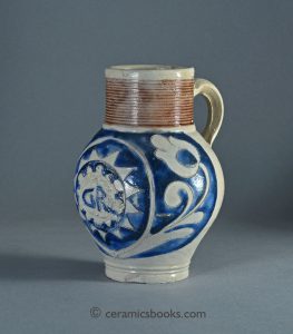Westerwald salt-glaze stoneware drinking jug with sprigged ‘GR’ medallion. 160mm High. c.1735-1765. AP/851.