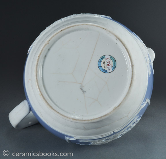 Porcelainous china jug with blue slip ground and white sprigs c.1815-1830. Base. AP/852