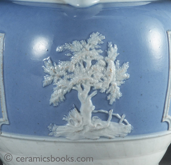 Porcelainous china jug with blue slip ground and white sprigs c.1815-1830. Front sprig. AP/852