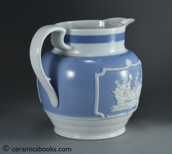 Porcelainous china jug with blue slip ground and white sprigs c.1815-1830. Handle. AP/852