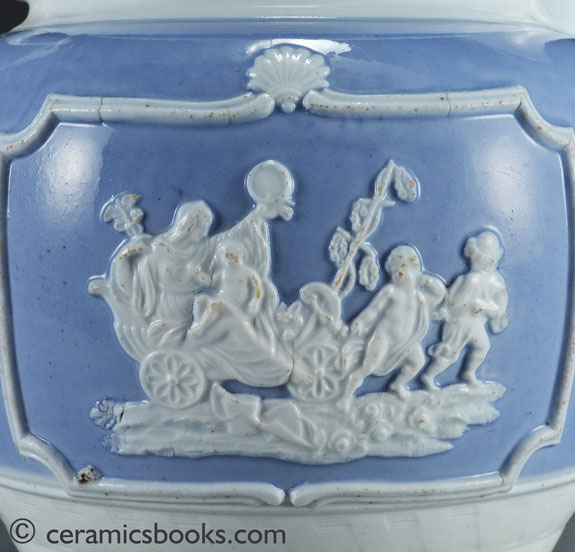 Porcelainous china jug with blue slip ground and white sprigs c.1815-1830. Reverse sprig.. AP/852