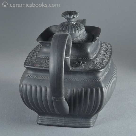 Black basalt teapot with crowns and Prince of Wales feathers possibly for coronation of King George IV. Back. AP/859
