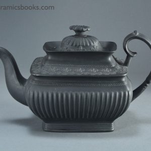 Black basalt teapot with crowns and Prince of Wales feathers possibly for coronation of King George IV. Obverse. AP/859