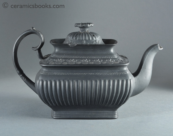 Black basalt teapot with crowns and Prince of Wales feathers possibly for coronation of King George IV. Reverse. AP/859