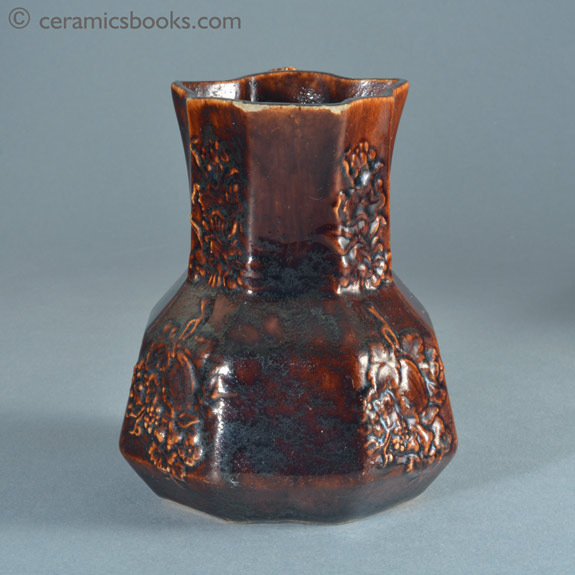 Small treacleware hydra type jug with crabstock handle, attributed to Swansea. Front. AP/886.