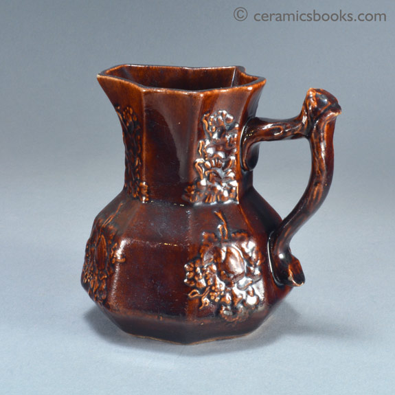 Small treacleware hydra type jug with crabstock handle, attributed to Swansea. Obverse. AP/886.