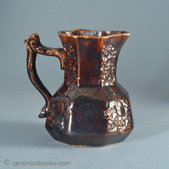 Small treacleware hydra type jug with crabstock handle, attributed to Swansea. Reverse. AP/886.
