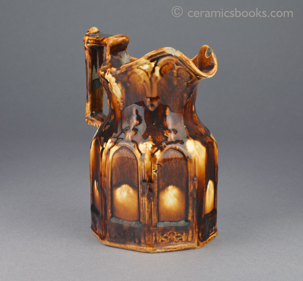 Two-tone treacleware moulded jug with Gothic arches. Reverse front. AP/888.