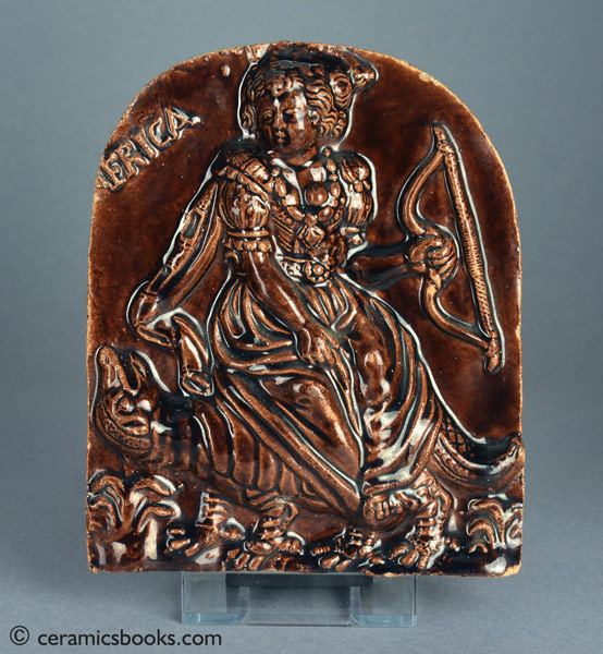 Treacleware (‘Rockingham’ brown glazed) wall plaque with icon of AMERICA. c.1800-1835. Front. AP/928.