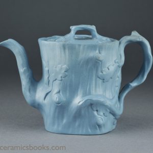 Blue stoneware crabstock teapot attributed to Ridgway & Abington, Hanley, Staffordshire. Obverse. AP/939.