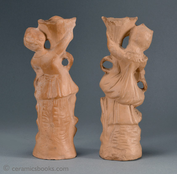 A pair of Continental terra-cotta figures, a boy and a girl with cornucopias. Back. AP/945 + AP/946.