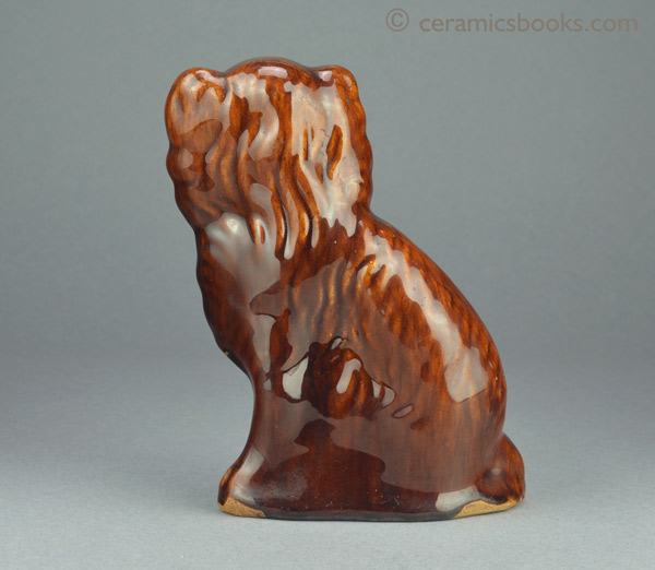 Treacleware (Rockingham glaze) spaniel dog figure. Probably Staffordshire. c.1850-1880. Reverse. AP/993.